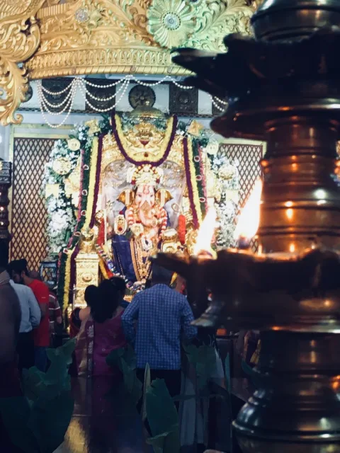 GSB Ganpati idol decorated with gold and silver ornamentation